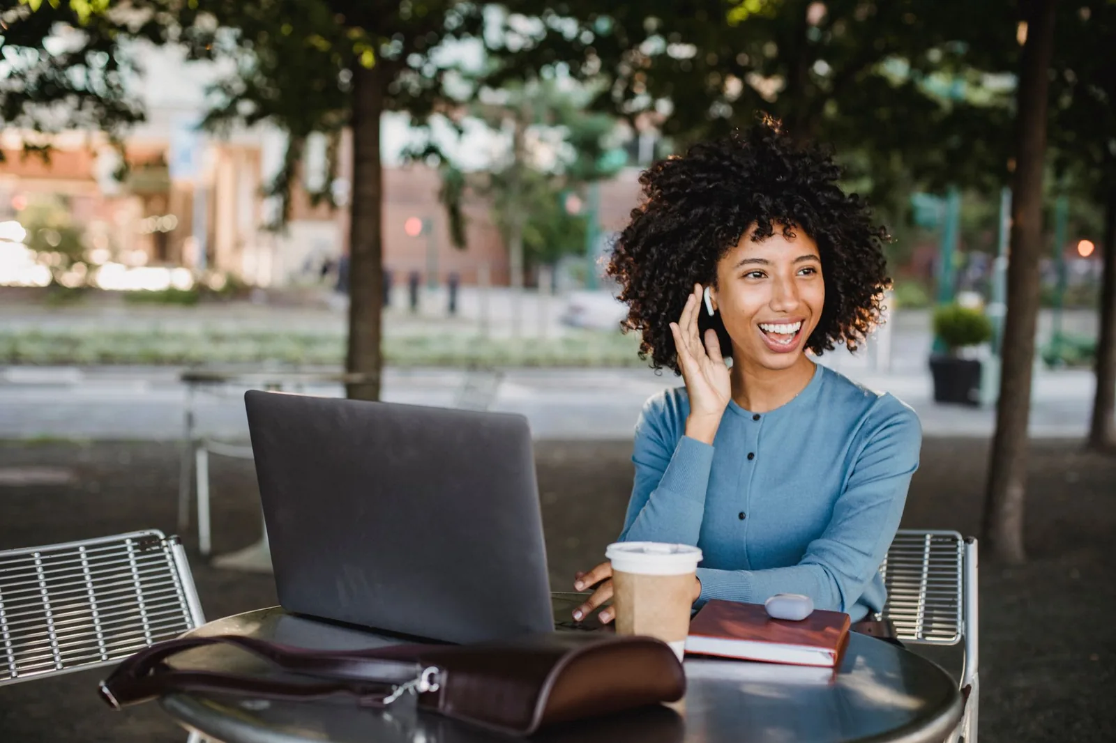 Person using ChatGPT on a phone and laptop while deciding between the Go and Plus plans