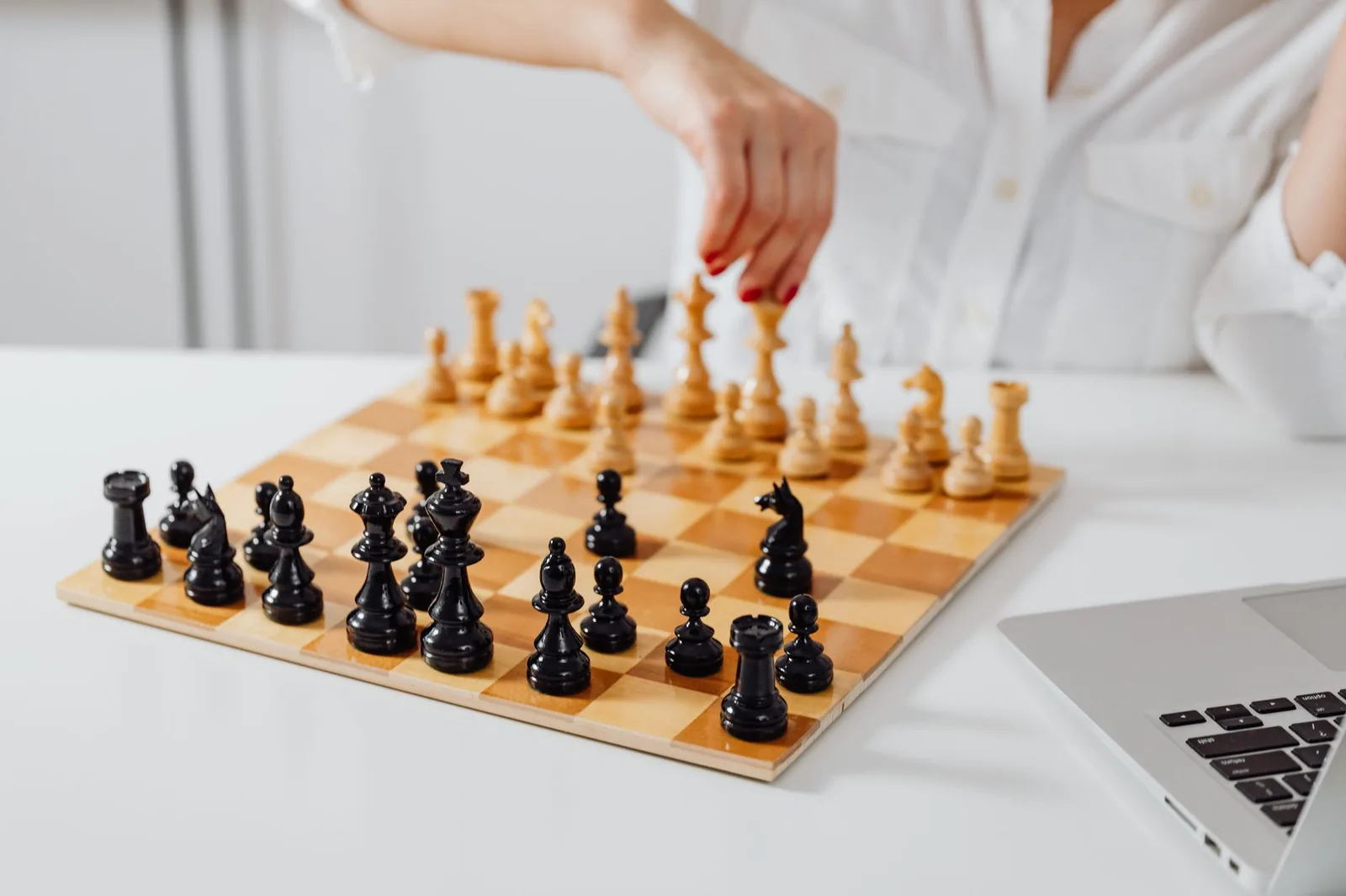 Chess board next to an open laptop, the setting of the viral GPT-6 Astra chess game