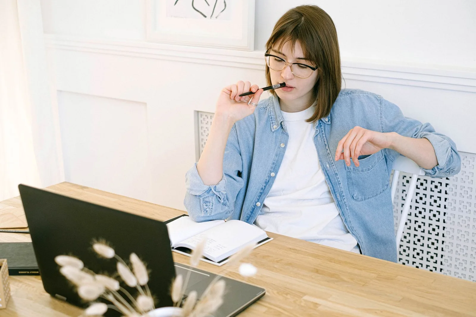 Person at a laptop deciding which Google AI plan unlocks Gemini 4 Argon